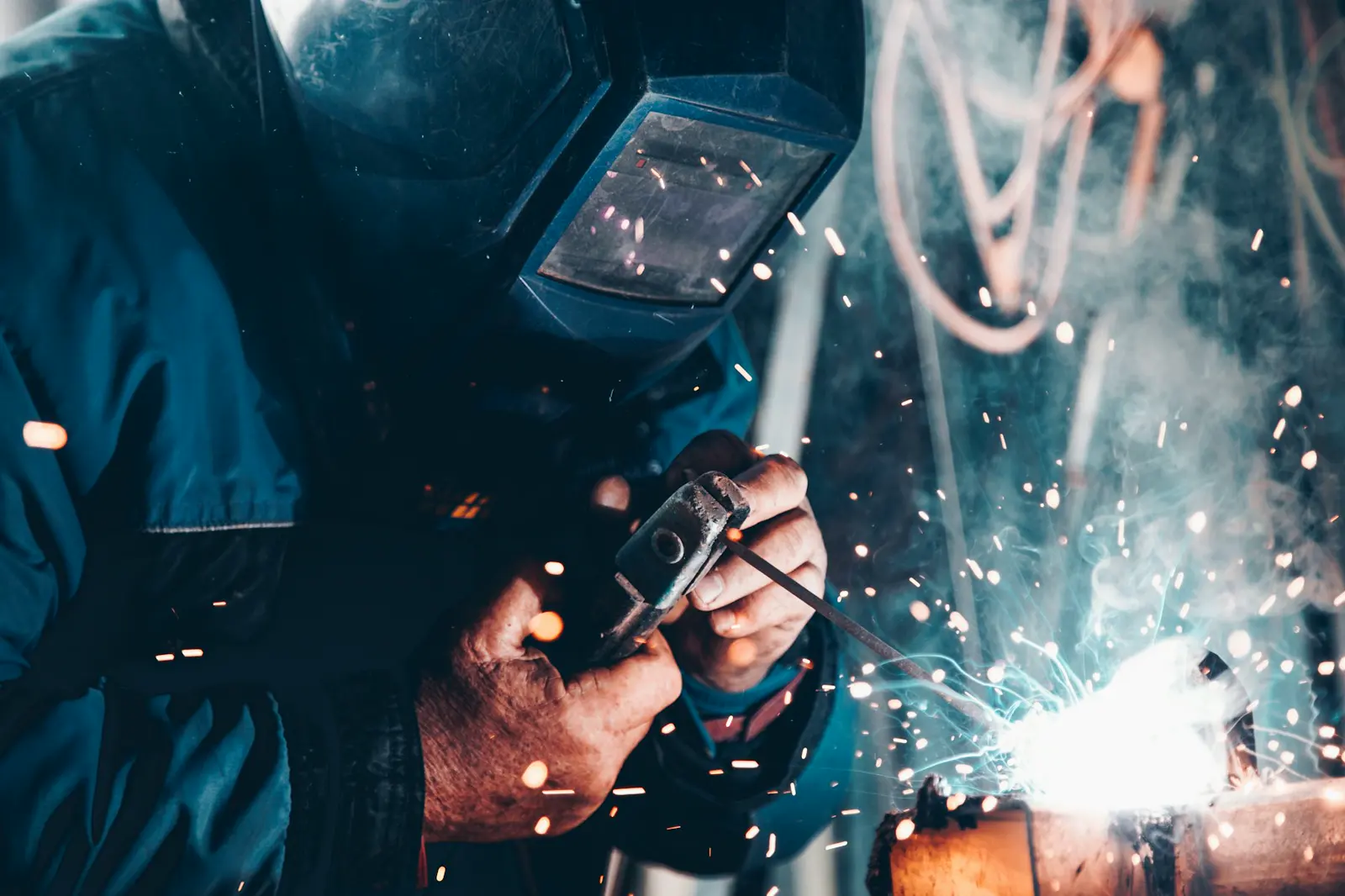 Stock photo of hand tools on a workbench, used to illustrate mechanical drain-clearing and jetting equipment setup