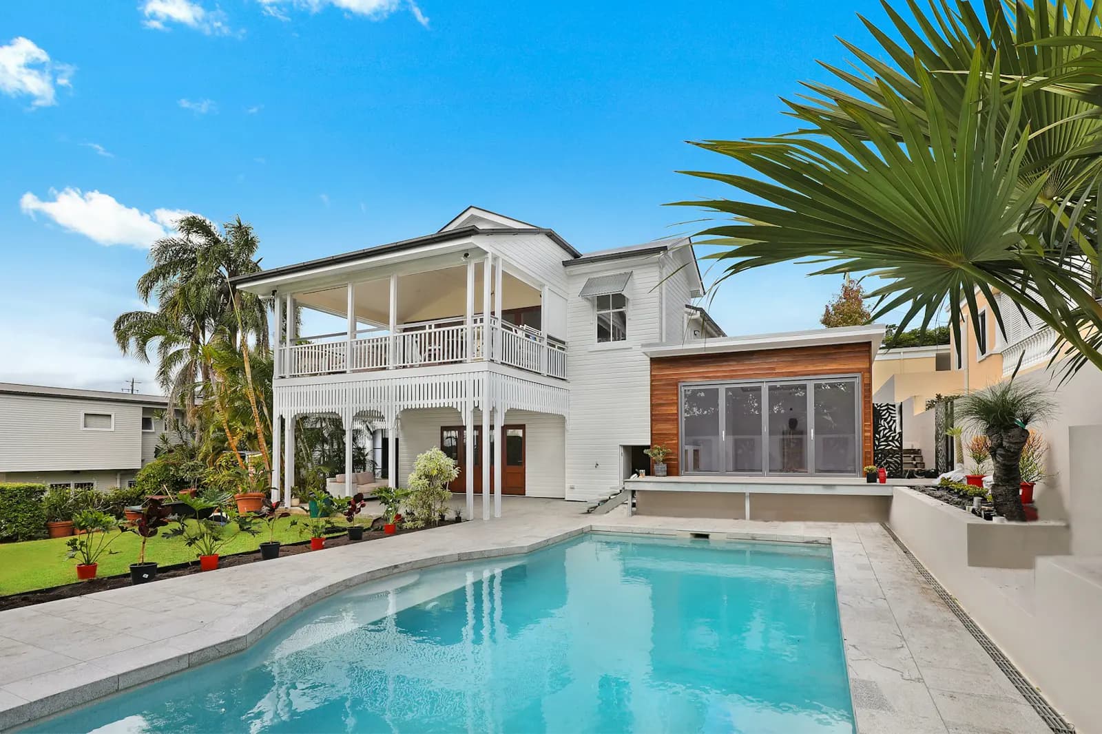 Stock photo of a single-family house exterior on a concrete foundation, used to illustrate slab-leak risk